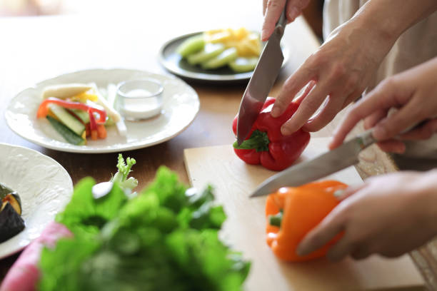 istock Female Hands Preparing Vegan Meal 1752170841
