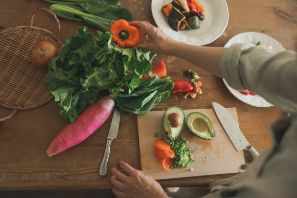 istock Female Hands Preparing Vegan Meal 1752170850