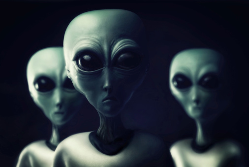 Photo realistic illustration created in Photoshop and other illustration applications. Three aliens approach in the night. What do they want Where are they from Who knows