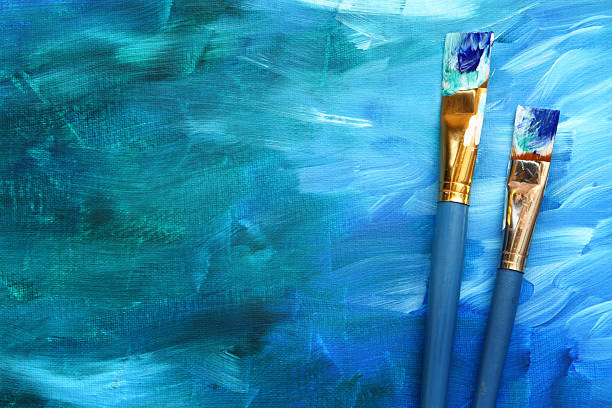 Abstract painting with paint brushes stock photo