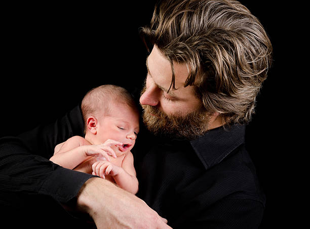 istock Father Holding Newborn Baby 175217241