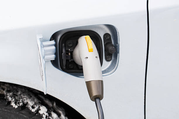 istock Closeup of an electric car plug while recharging 175217436