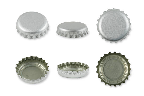 tapas de metal de plata - bottle cap fotografías e imágenes de stock