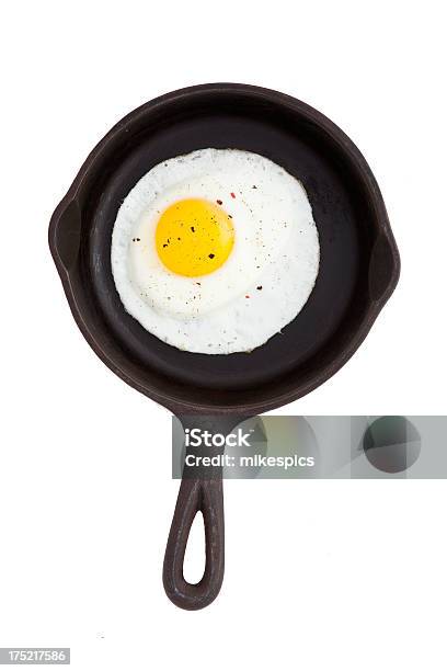 Cast Iron Skillet With Fried Egg Isolated On White Stock Photo - Download Image Now