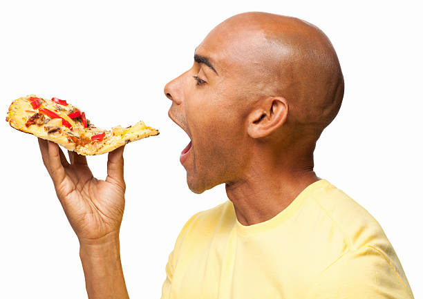 homem comer uma fatia de pizza-isolada - one slice imagens e fotografias de stock