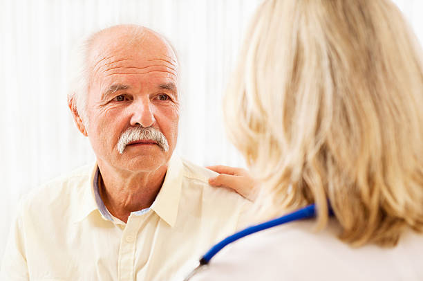 istock Female doctor talking with a senior patient 175217984