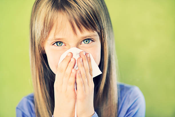 istock Little girl cleaning nose 175218521