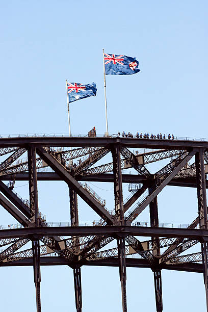 istock Steel structure of bridge with tourists and two Australian flags 175218572