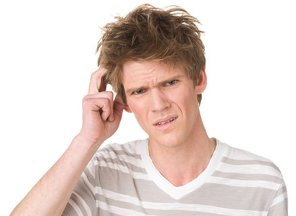 istock Uncertain Confused Young Man Scratching Head 175219373