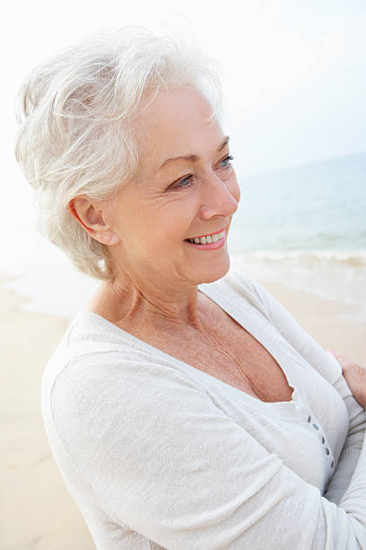 istock Senior Woman Standing On Beach 175219454