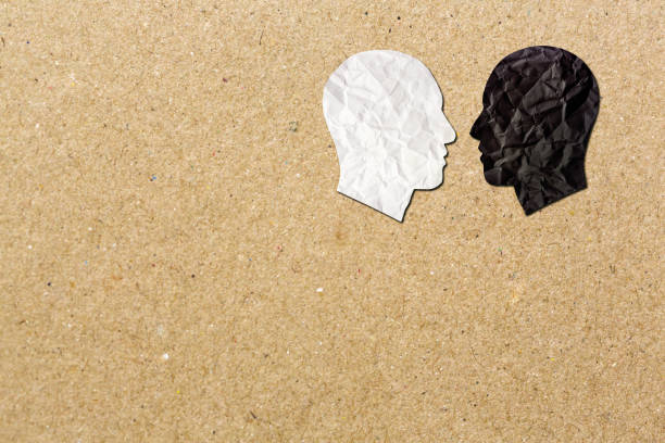 istock Multiracial faces in profile, face to face, symbolizing diversity, cooperation or conflict. 1752197286