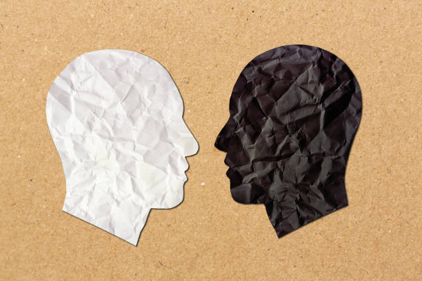 istock Multiracial faces in profile, face to face, symbolizing diversity, cooperation or conflict. 1752199033