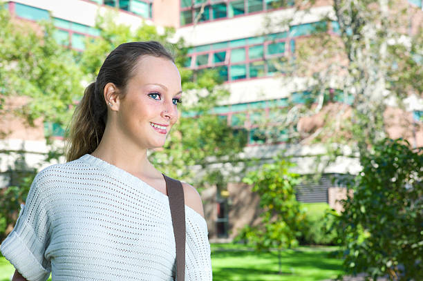 Beautiful College Student with a Book Bag or Purse.