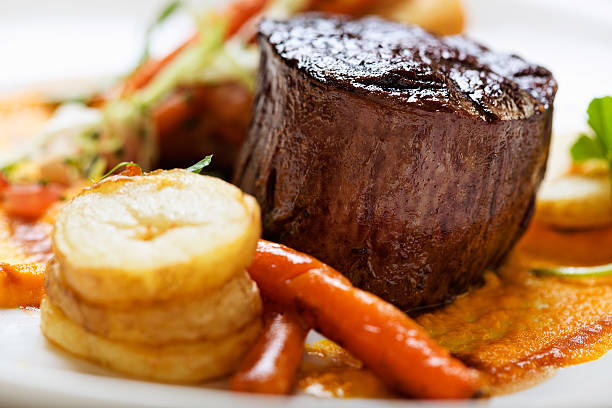 istock Grilled fillet steak with sauteed vegetables and meat jus 175220331