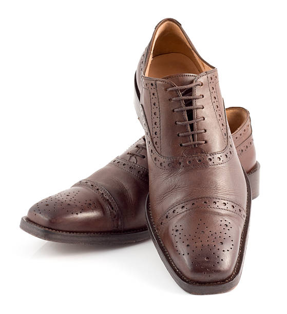istock Pair of brown leather brogue shoes with decorative patterns 175220356