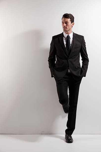 istock Businessman standing with his hands in pockets 175220523