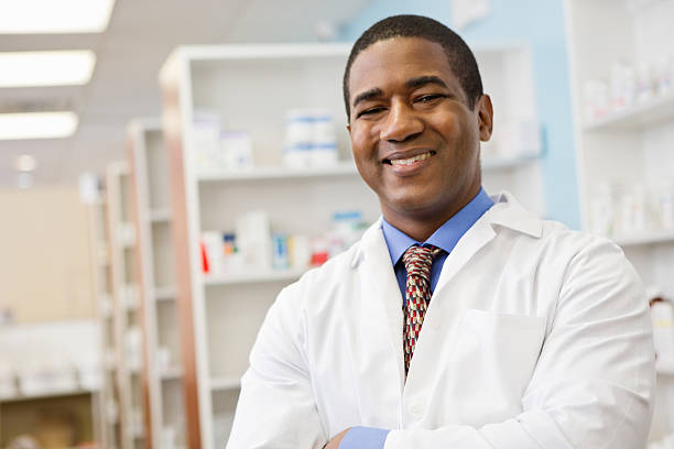istock Happy pharmacist working at pharmacy/ medicine in background 175220744