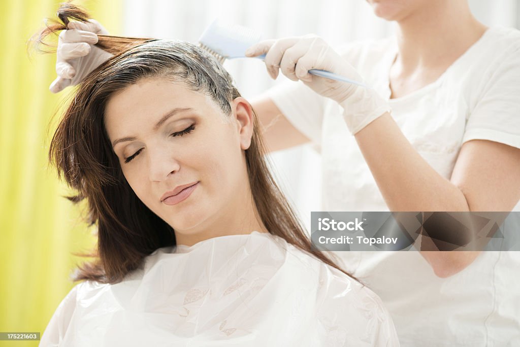 Hair dye Portrait of woman enjoying in professional hair dye Dye Stock Photo