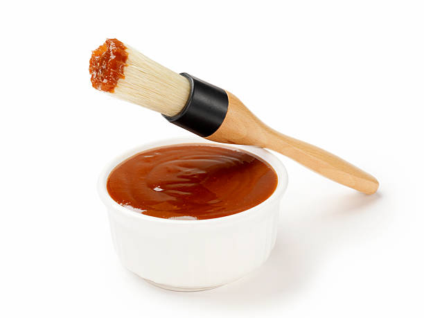 BBQ Sauce with Brush BBQ Sauce with Brush -Photographed on Hasselblad H3D2-39mb Camera barbeque sauce photos stock pictures, royalty-free photos & images