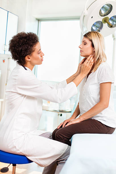 istock Female doctor checking thyroid gland 175221911