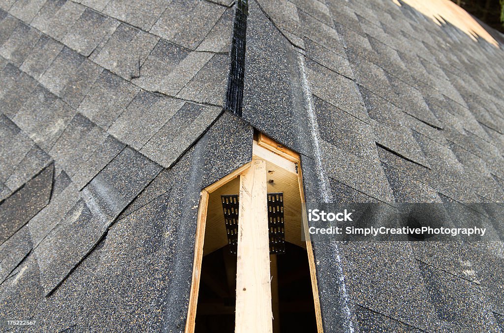 Ridge Vent "View of a partially shingled house roof, showing the cut-out for a ridge vent at the peak of the roof.Similar Images:" Air Duct Stock Photo