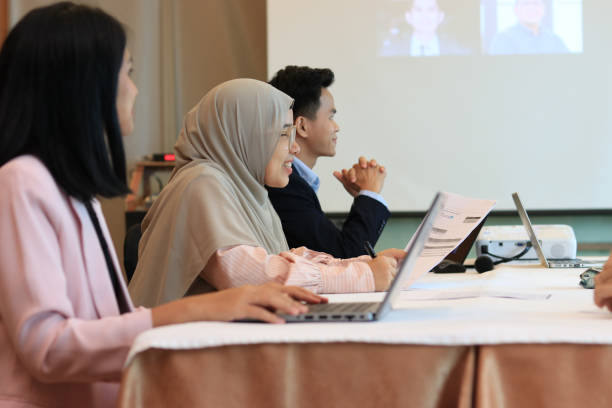 istock Female moderator talking to business seminar participants 1752230515