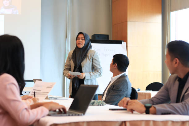 istock Female moderator talking to business seminar participants 1752230518