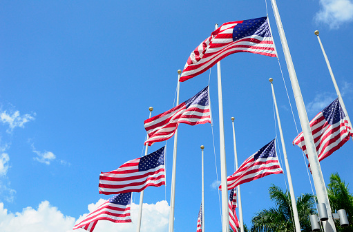 American Flags fly at half mast in observance of September 11.