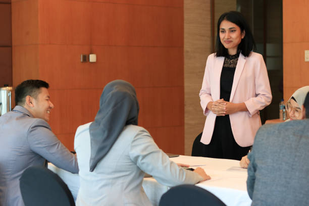 istock Female moderator talking to business seminar participants 1752231765