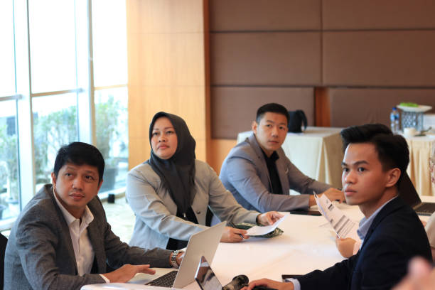 istock Female moderator talking to business seminar participants 1752233102