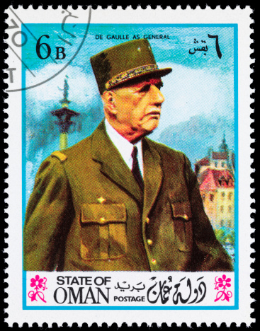 Oman postage stamp with an illustration of Charles De Gaulle in a General's uniform.