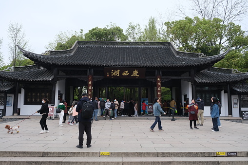 Yangzhou,China-April 5th 2023: entrance of Slender West Lake and tourists. A scenic lake in Yangzhou, China