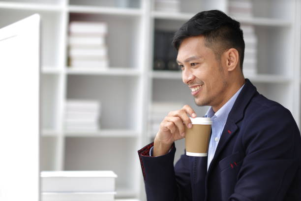 istock Businessman working with laptop computer in office and drinking coffee in the morning. 1752236777