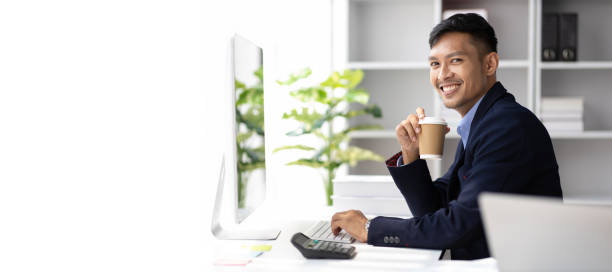 istock Businessman working with laptop computer in office and drinking coffee in the morning. 1752236780