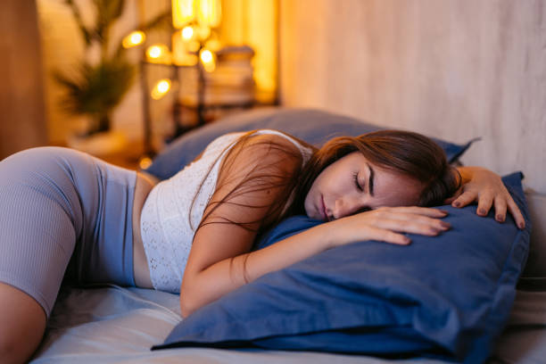 istock Young Woman Sleeping In The Bed At Night 1752237489