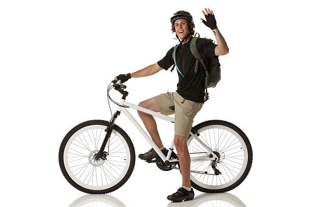 istock Male cyclist waving his hand and smiling 175223758