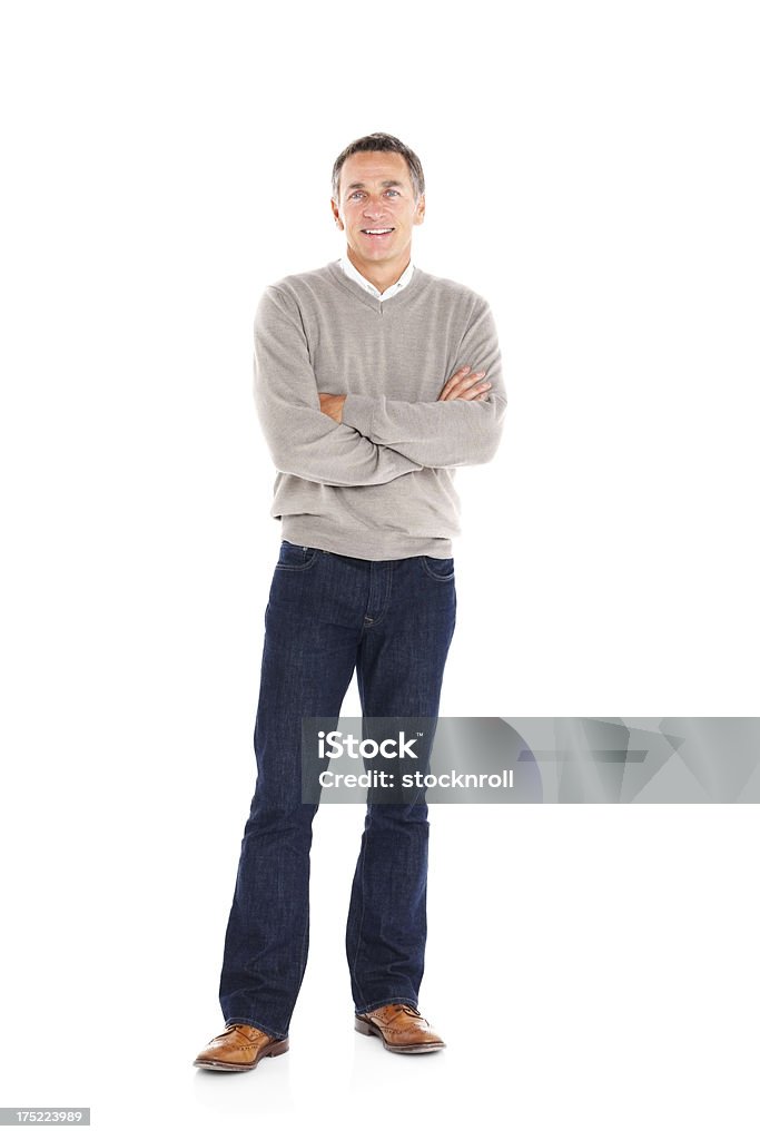 Handsome mature man standing with his arms crossed on white Full length portrait of handsome mature man standing with his arms crossed on white background Standing Stock Photo