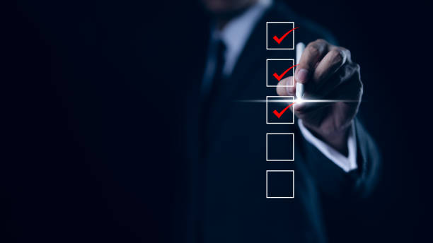 istock Businessman checking mark on checklist with a red checkmark. online checklist survey, filling out digital form checklist. take an assessment, questionnaire, evaluation, online survey, online exam, 1752247718