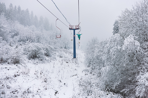 Beautiful frosty winter landscape of ski lift in snowy Carpathian mountains, Slavsko, Ukraine.