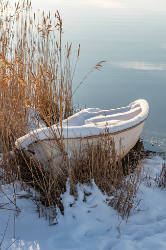 Small rowboat on land in winter. Reed boat :-P