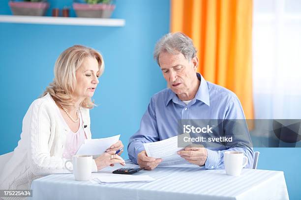 Senior Couple With Bills Stock Photo - Download Image Now - 60-64 Years, Couple - Relationship, Financial Bill