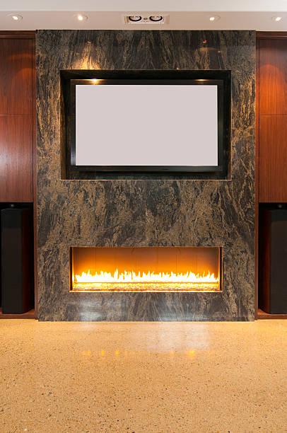 Flat screen TV over Fireplace Mantel stock photo