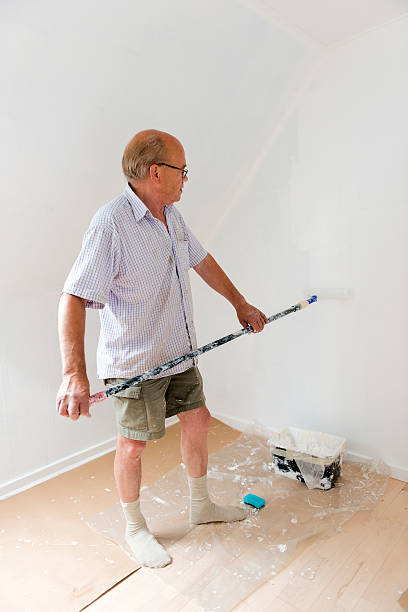 istock Senior man makes home improvement with new paint 175226339
