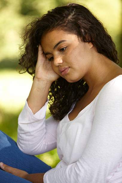 istock Sad Young Woman Sitting In Park 175226831