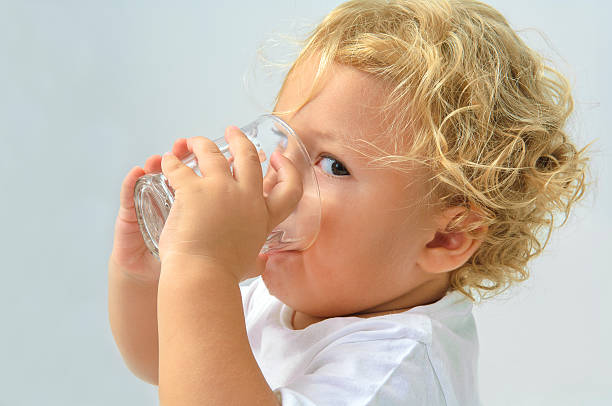 The small boy is drinking water from glassPlease see some similar pictures from my portfolio: