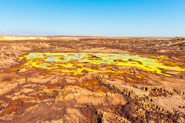 Hot Springs on Dallol Mountain "Hot Springs and geothermal / volcanic activity on Dallol Mountain. The characteristic white, yellow and red colours are the result of sulphur and potassium salts coloured by various ions. Dallol volcano is located in the Danakil Depression with the highest average temperatures on the planet. Ethiopia." dallol ethiopia stock pictures, royalty-free photos & images