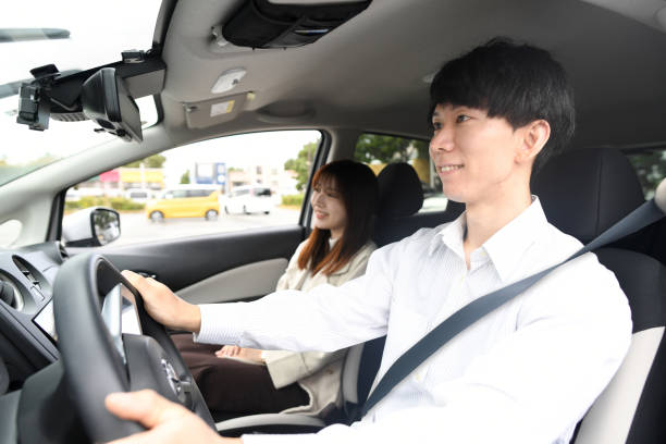istock Young Asian couple enjoying driving 1752276154
