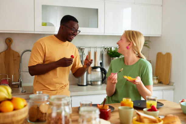 istock Multiracial couple enjoying breakfast together at home 1752277053