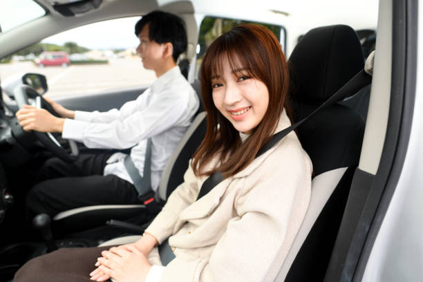 istock Young Asian couple enjoying conversation in the car 1752278365