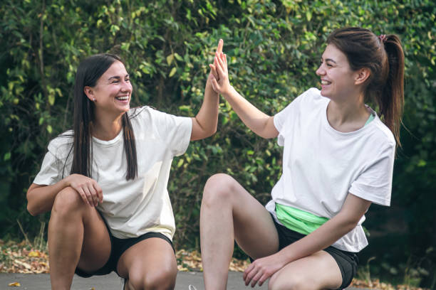istock Two friends high-five each other after jogging in the park. 1752278679
